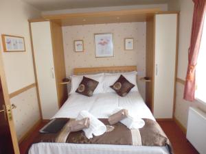a bedroom with a bed with two towels on it at Kingscliff in Blackpool
