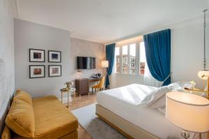 Postel nebo postele na pokoji v ubytování H10 Palazzo Canova