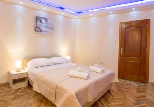 Postel nebo postele na pokoji v ubytování Apartments Vila Marija