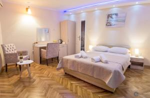 Postel nebo postele na pokoji v ubytování Apartments Vila Marija
