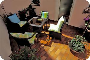 a view of a living room with chairs and plants at Haus Berlin in Kaub