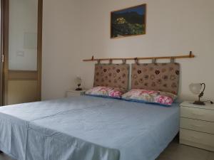 A bed or beds in a room at Salvia