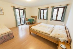 Postel nebo postele na pokoji v ubytování Holiday House Vitice 21