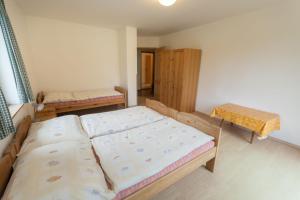 Postel nebo postele na pokoji v ubytování Holiday House Vitice 21