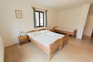Postel nebo postele na pokoji v ubytování Holiday House Vitice 21