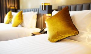 Voodi või voodid majutusasutuse Iveagh Garden Hotel toas