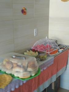 a buffet with different types of food on a counter at Pousada Don'Ana in Conde
