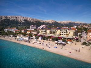 an aerial view of a beach with buildings and the water at Valamar Atrium Baška Residence in Baška