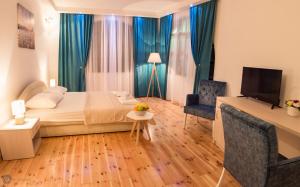 TV a/nebo společenská místnost v ubytování Apartments Vila Marija