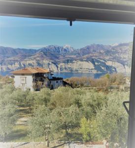 a view of a lake from a window at Mansardino in Malcesine