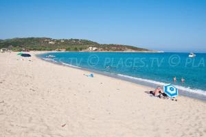 a group of people on a beach near the water at Le Domaine De Marie in Palasca