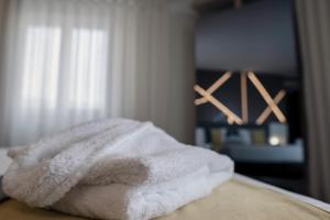 Cama ou camas em um quarto em THE ONE Grand Hotel da Póvoa - by MHMB Hospitality