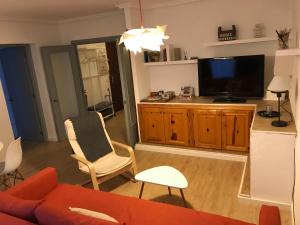 Televízia a/alebo spoločenská miestnosť v ubytovaní HabitaHost Colón