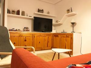 Televízia a/alebo spoločenská miestnosť v ubytovaní HabitaHost Colón
