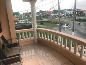 a balcony with a view of a street at Brookville in Georgetown +16 photos
