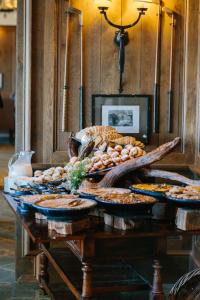 a table with many different types of food on it at Trump International Golf Links & Hotel Doonbeg Ireland in Doonbeg