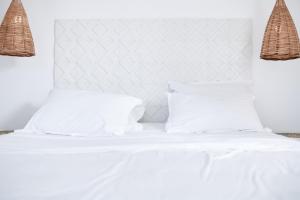 Postel nebo postele na pokoji v ubytování Amare Mykonos