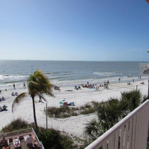 a beach with a lot of people on it at Edison Beach House in Fort Myers Beach