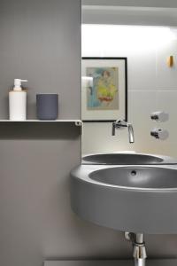 a bathroom with a sink and a mirror at ATERIAN LOFT 2 in Zarautz