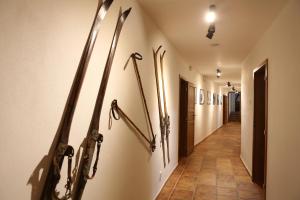 a hallway with skis hanging on the wall at Chata Pelikán in Loučná nad Desnou