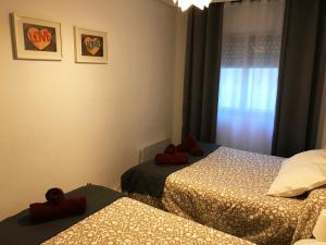 Posteľ alebo postele v izbe v ubytovaní HabitaHost Colón