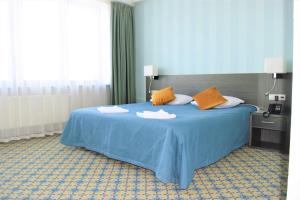 
Кровать или кровати в номере Zavidovo Resort
