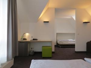 Postel nebo postele na pokoji v ubytování Comfor Hotel Ulm City