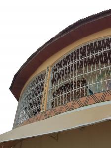 a building with a large window on the side of it at Hostel Roraima in Boa Vista