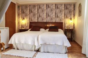 Postel nebo postele na pokoji v ubytování Hotel Iris La Eliana