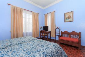 Postel nebo postele na pokoji v ubytování Hotel La Cartuja