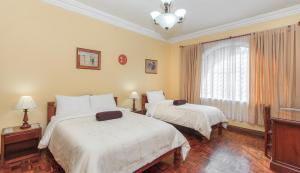 Postel nebo postele na pokoji v ubytování Hotel La Cartuja