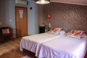 Postel nebo postele na pokoji v ubytování Hotel Iris La Eliana