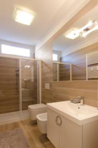 a bathroom with a shower toilet and a sink at Dante 124 | Appartamenti a Riccione in Riccione