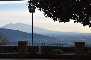 a street light with a view of a city at Guardanapoli in Cervino