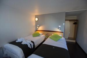Voodi või voodid majutusasutuse Campanile Saumur toas
