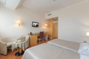 TV a/nebo společenská místnost v ubytování Hotel Minerva