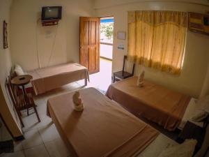 Cama o camas de una habitación en Remari Tourist Inn