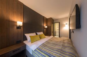 Postel nebo postele na pokoji v ubytování Hotel Smartino
