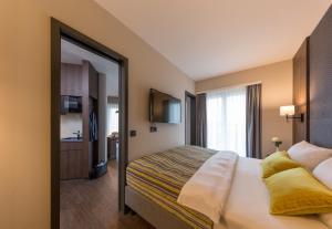 Postel nebo postele na pokoji v ubytování Hotel Smartino