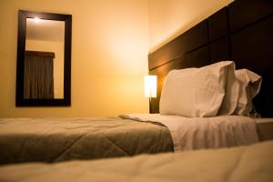 Postel nebo postele na pokoji v ubytování Hotel Brisa Rio