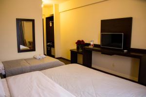 Postel nebo postele na pokoji v ubytování Hotel Brisa Rio