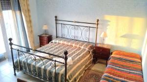 En eller flere senge i et værelse på B&B Archia