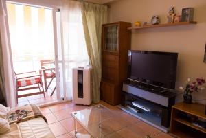 Телевизор и/или развлекательный центр в Apartamento Solárium