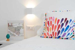 A bed or beds in a room at Villa Edoné Frontemare