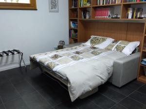 מיטה או מיטות בחדר ב-Maison Beauregard
