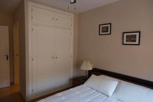 Кровать или кровати в номере Apartamento Solárium