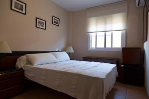 Кровать или кровати в номере Apartamento Solárium +37 фотографий