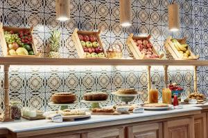 a display of fruits and vegetables on a counter at Angelina Boutique Escape in Perdika