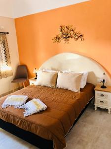 Ένα ή περισσότερα κρεβάτια σε δωμάτιο στο Πανσιόν Ζαχαρούλα