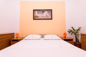 Posteľ alebo postele v izbe v ubytovaní Apartmani MM